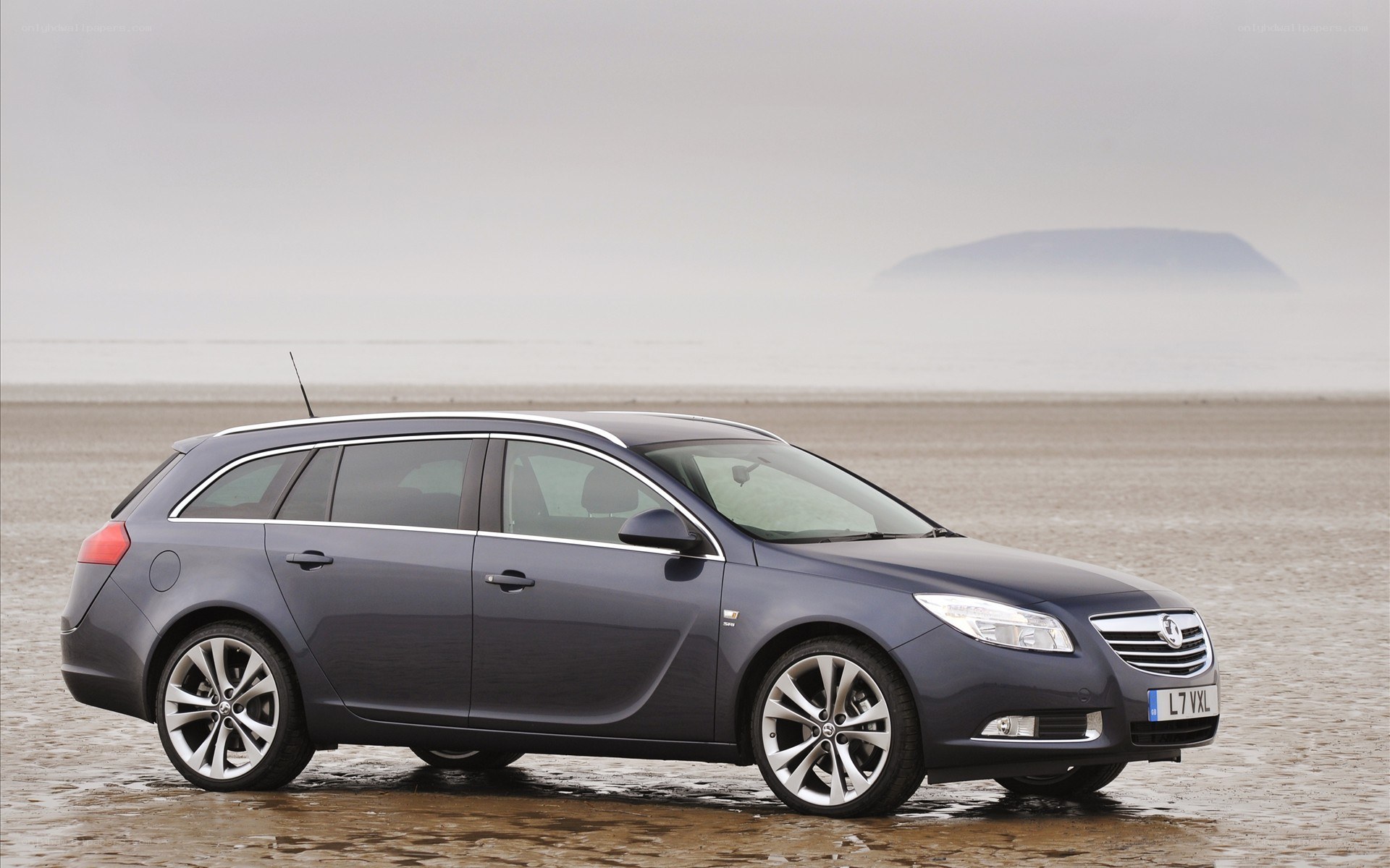 dark gray station wagon on beach