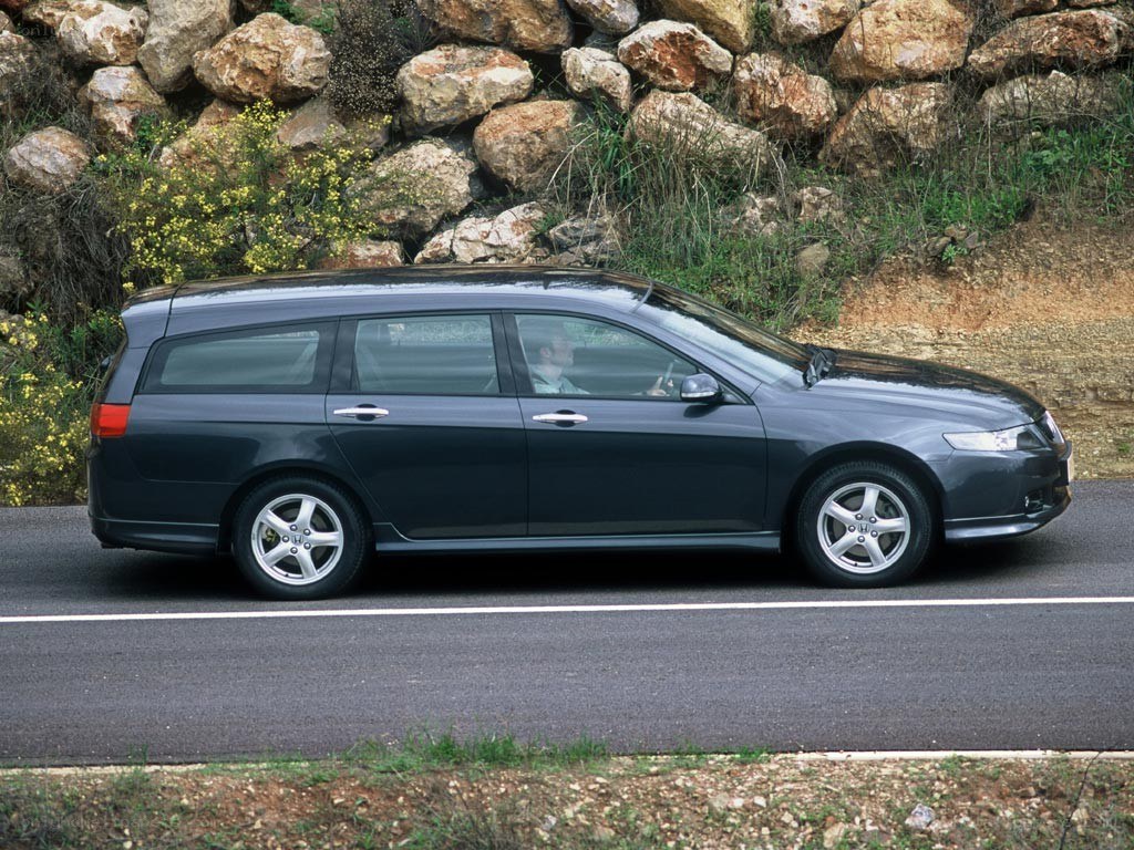 dark gray station wagon on road