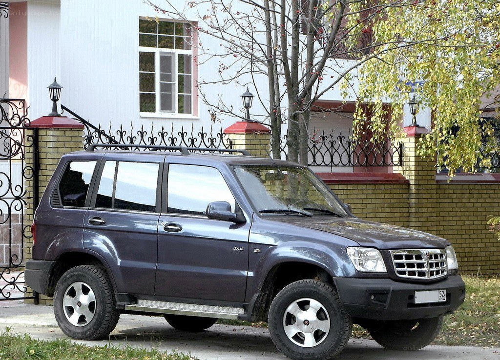 dark gray suv parked outside house