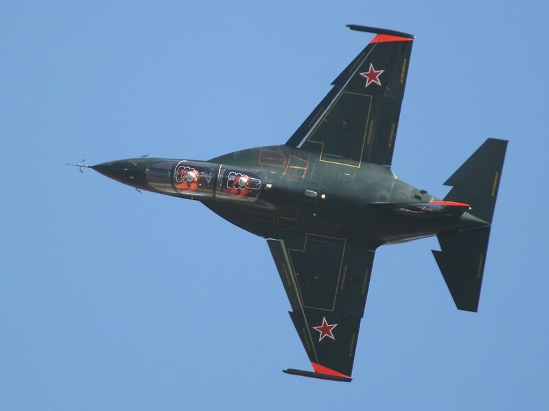 dark green jet with red stars