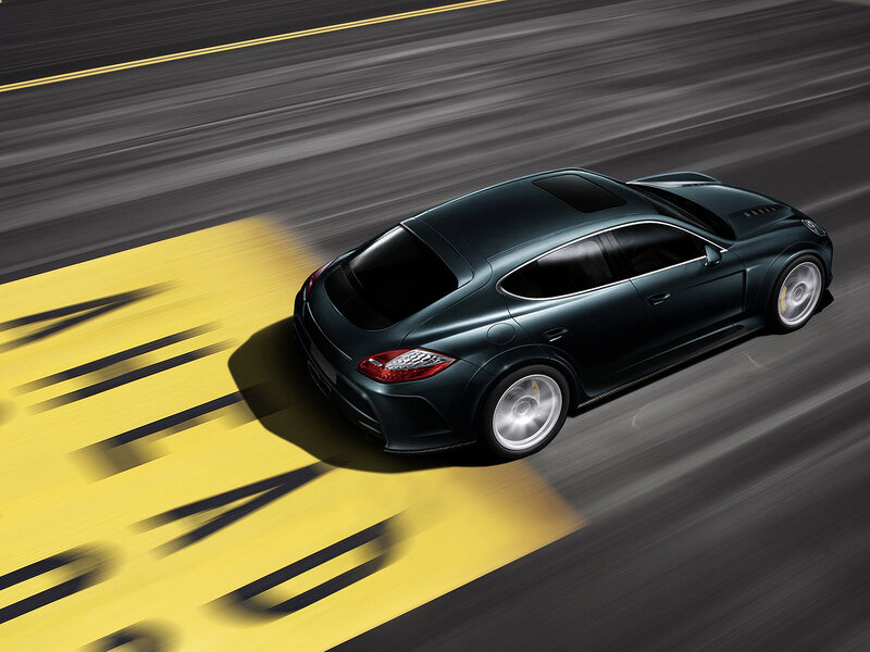Dark green sports car on track