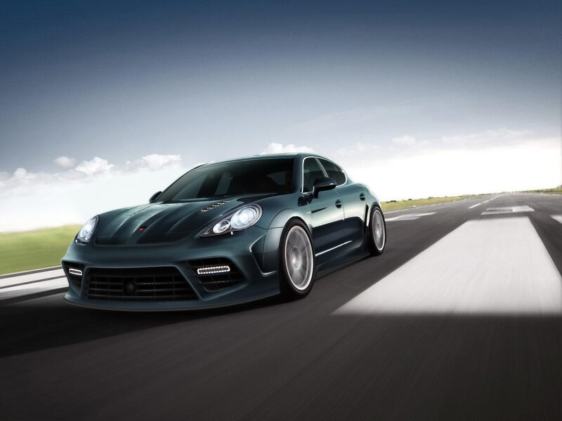 dark green sports car on track