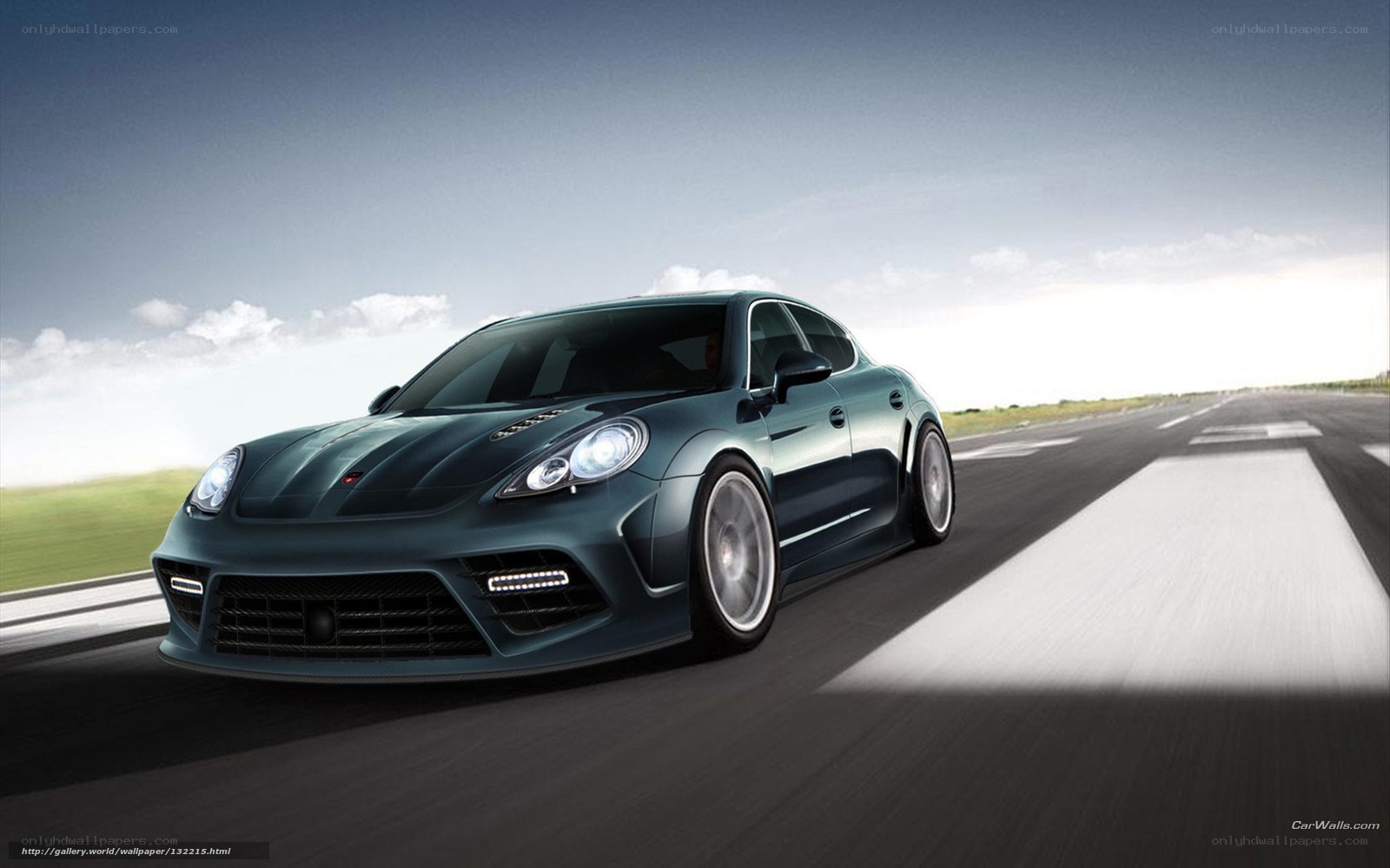 dark green sports car on track