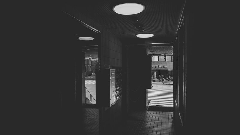 Dark Hallway Leading to Street