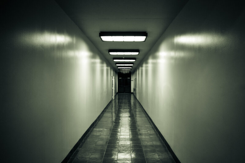 dark hallway with fluorescent lights