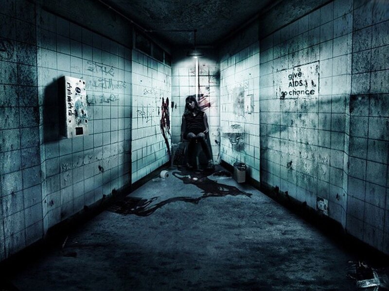 Dark hallway with seated figure