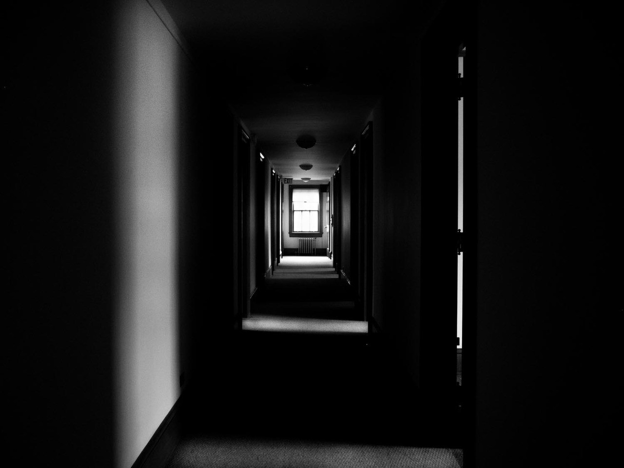 dark hallway with window at end