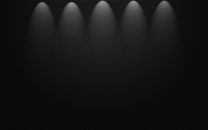 dark hexagonal wall with spotlights