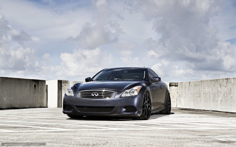Dark Infiniti G37 parked on rooftop