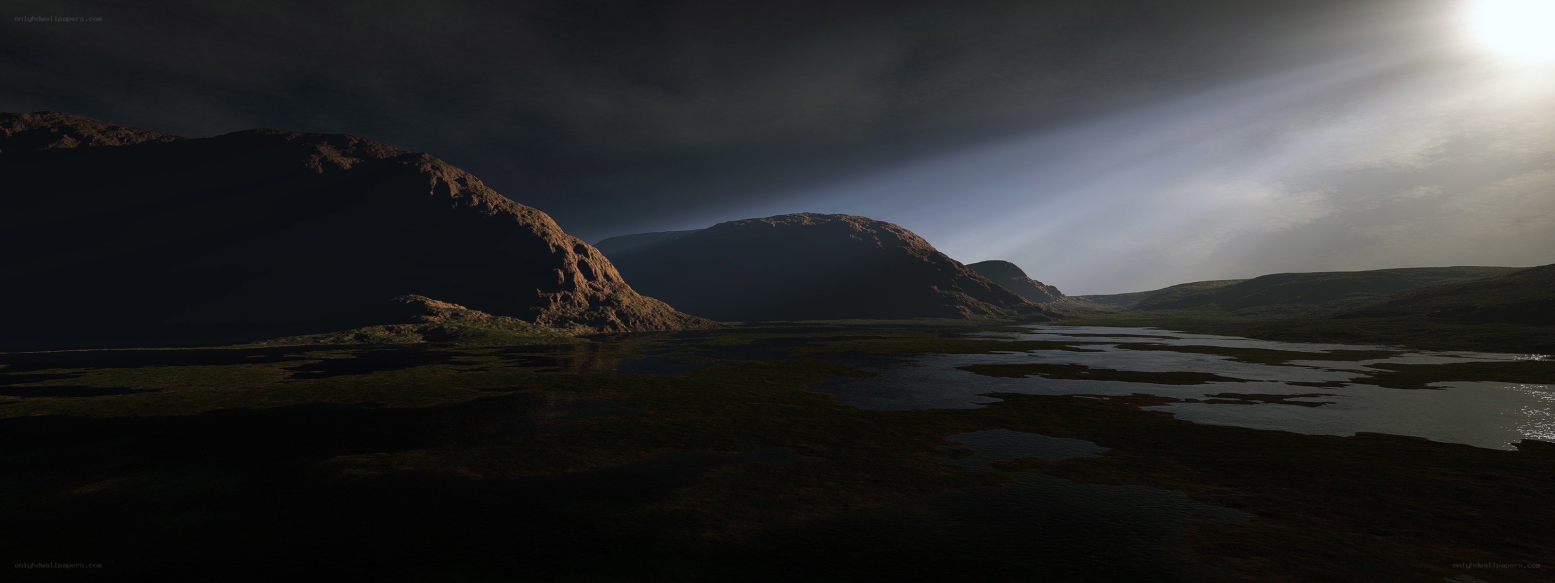 Dark landscape with sunbeams