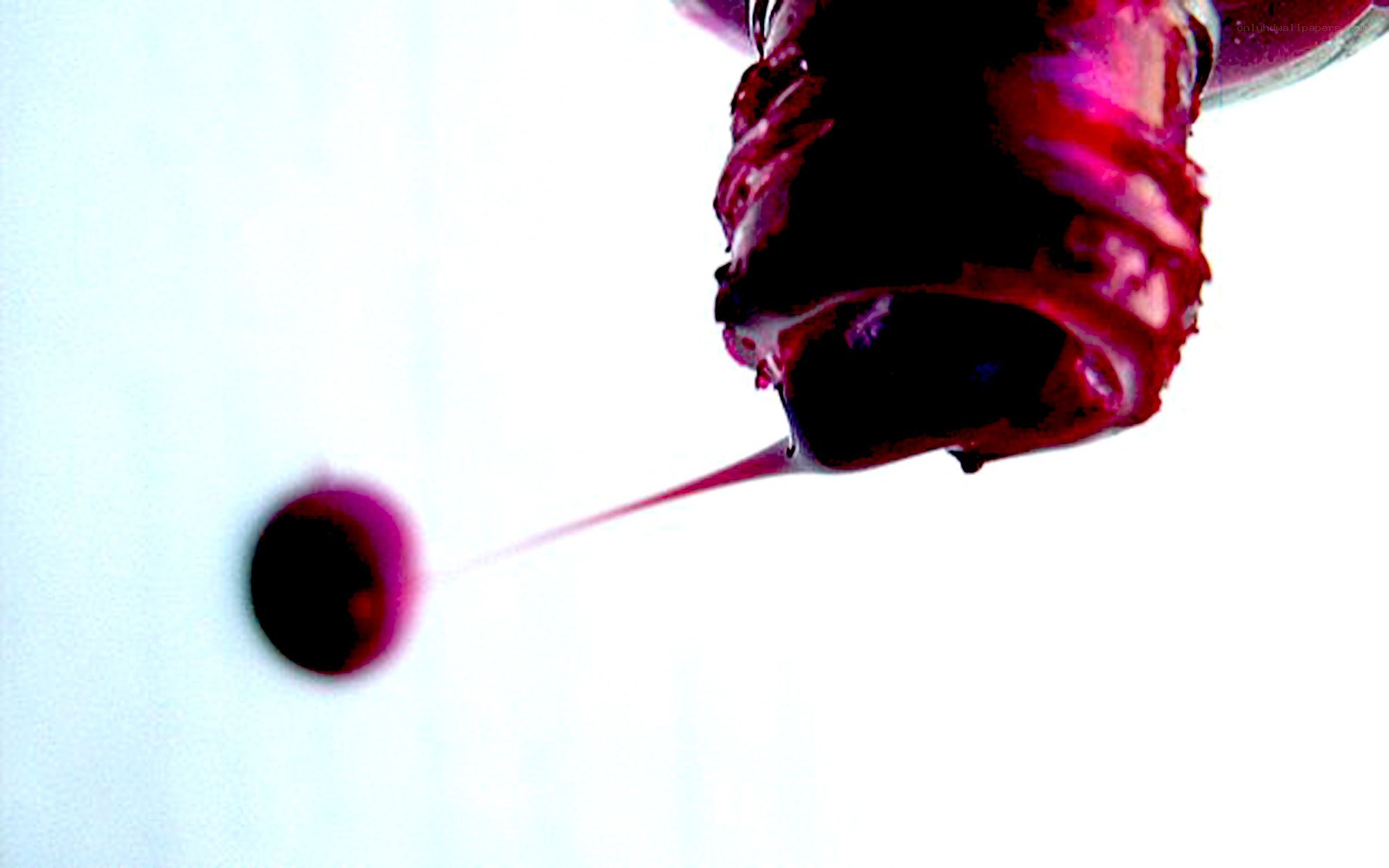dark liquid dripping from container