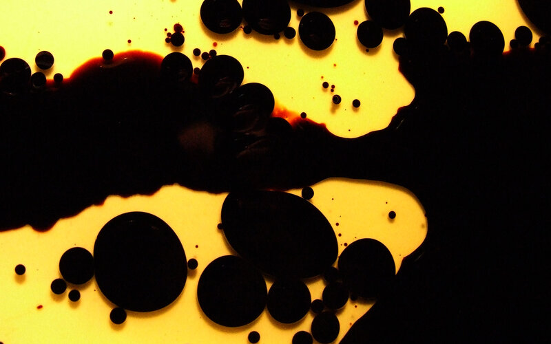 dark liquid on yellow surface