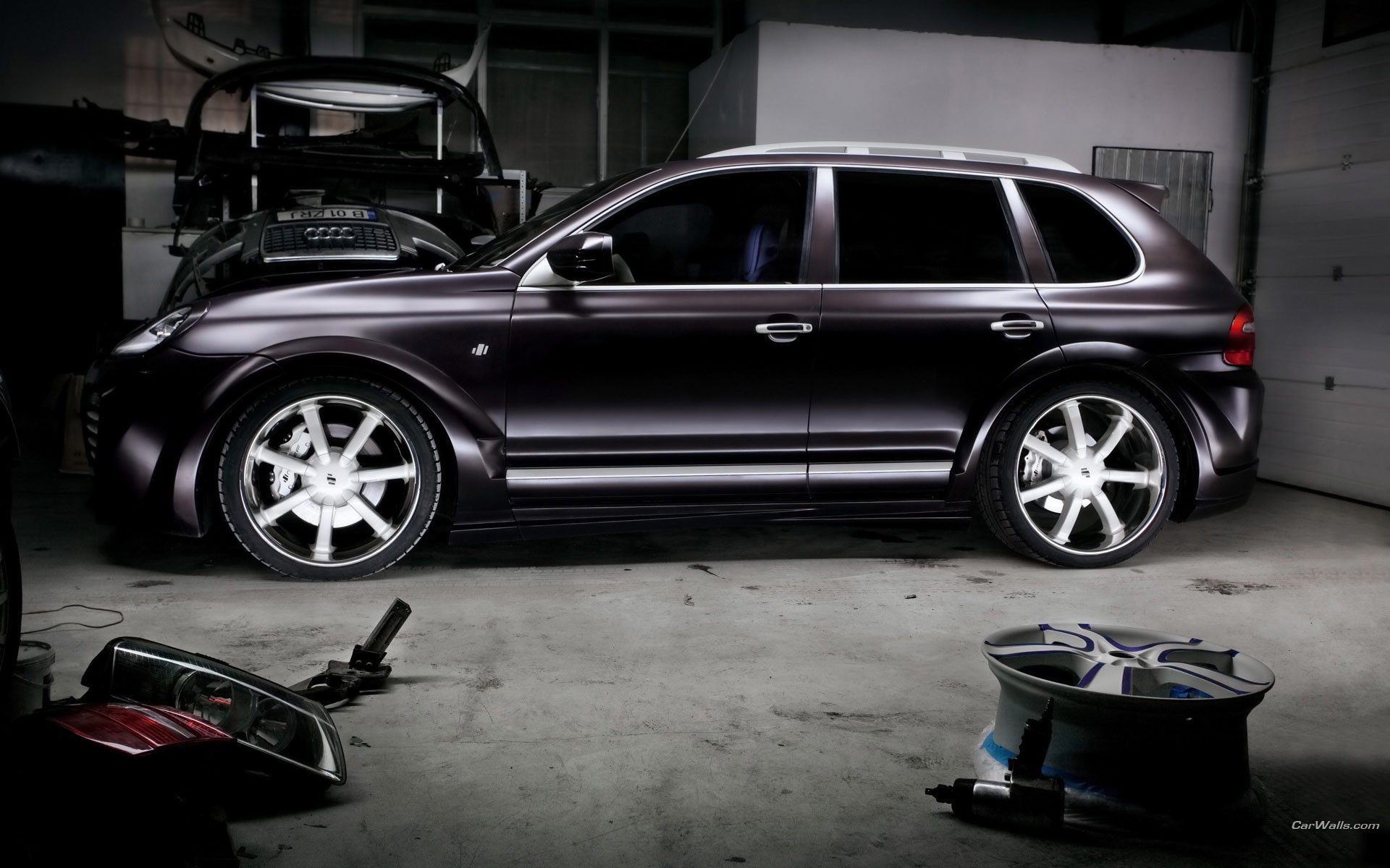 Dark matte SUV in garage