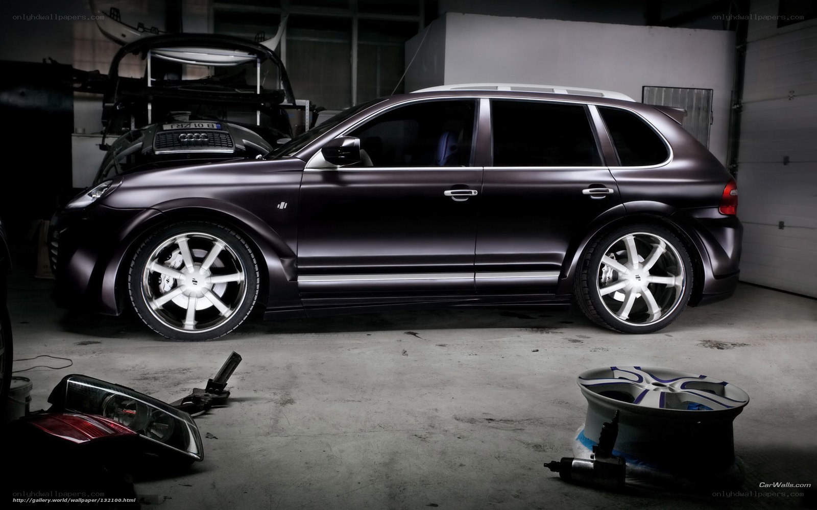 Dark matte SUV in garage