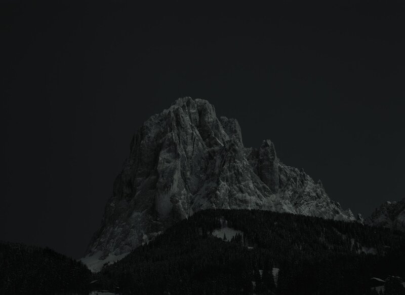 Dark mountain peak at night