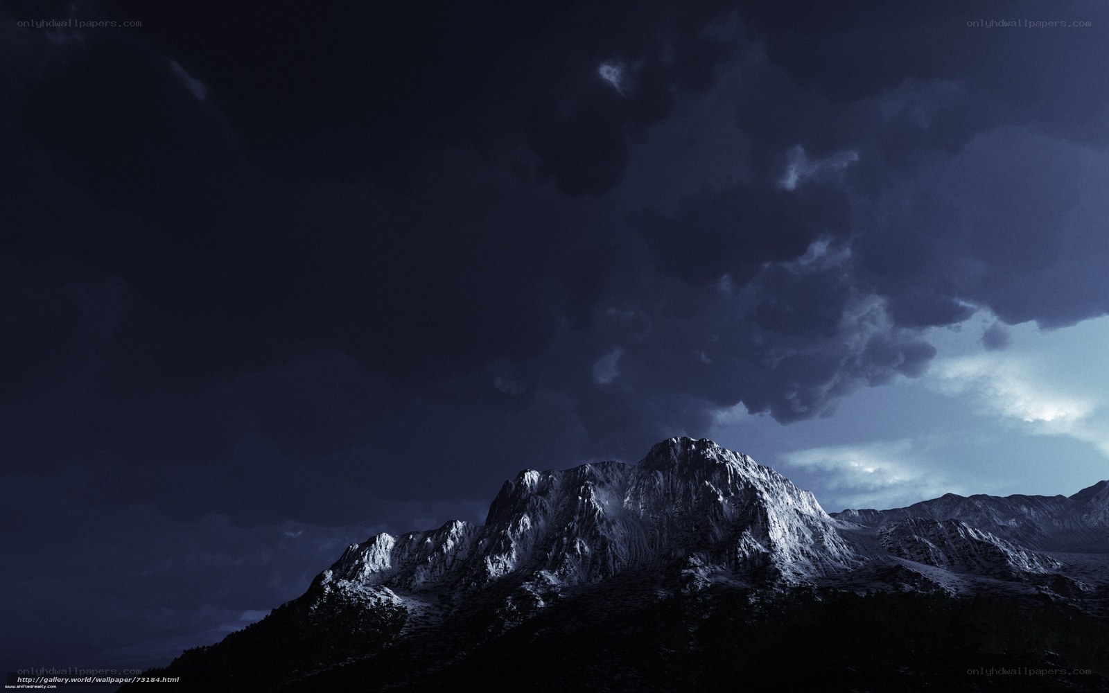 Dark mountain under stormy sky