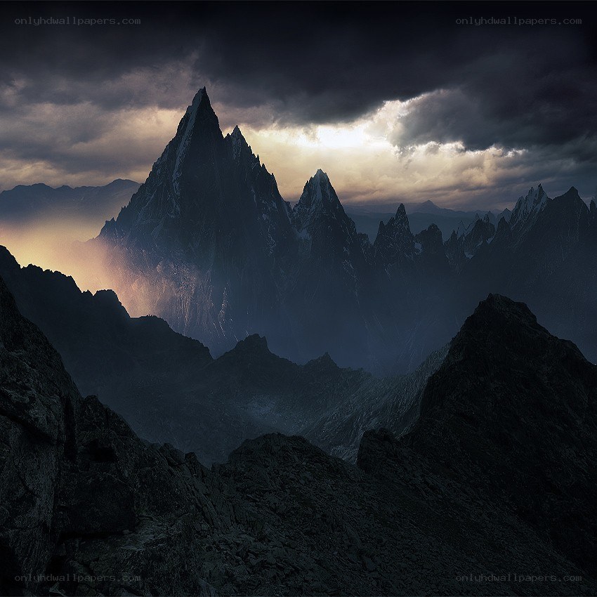 Dark mountains under stormy sky