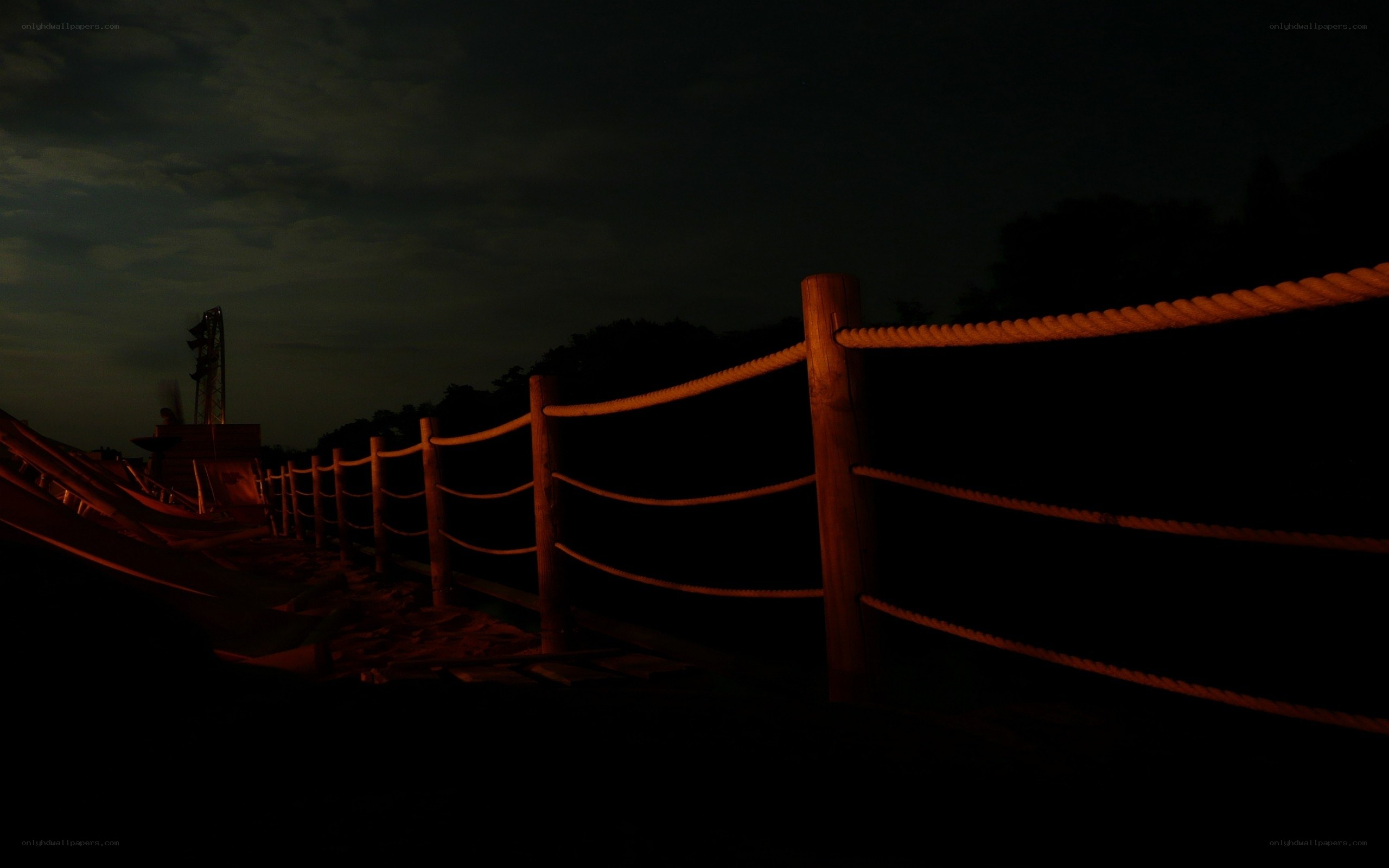 Dark night with rope fence