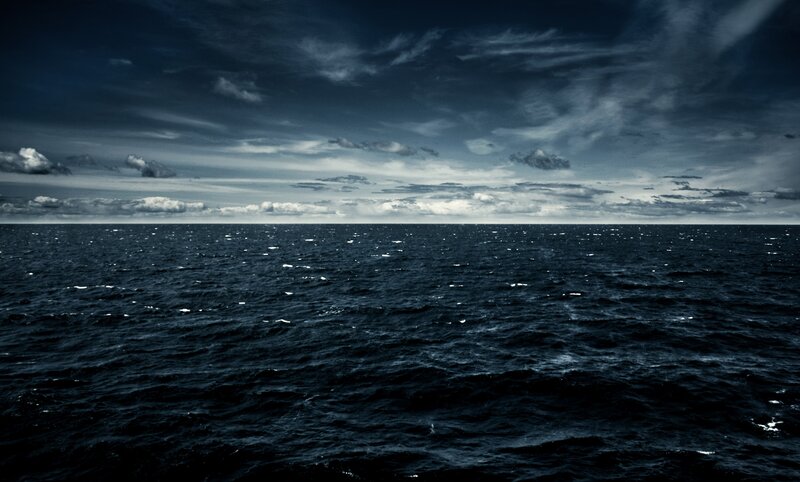 Dark Ocean under Cloudy Sky — Blue