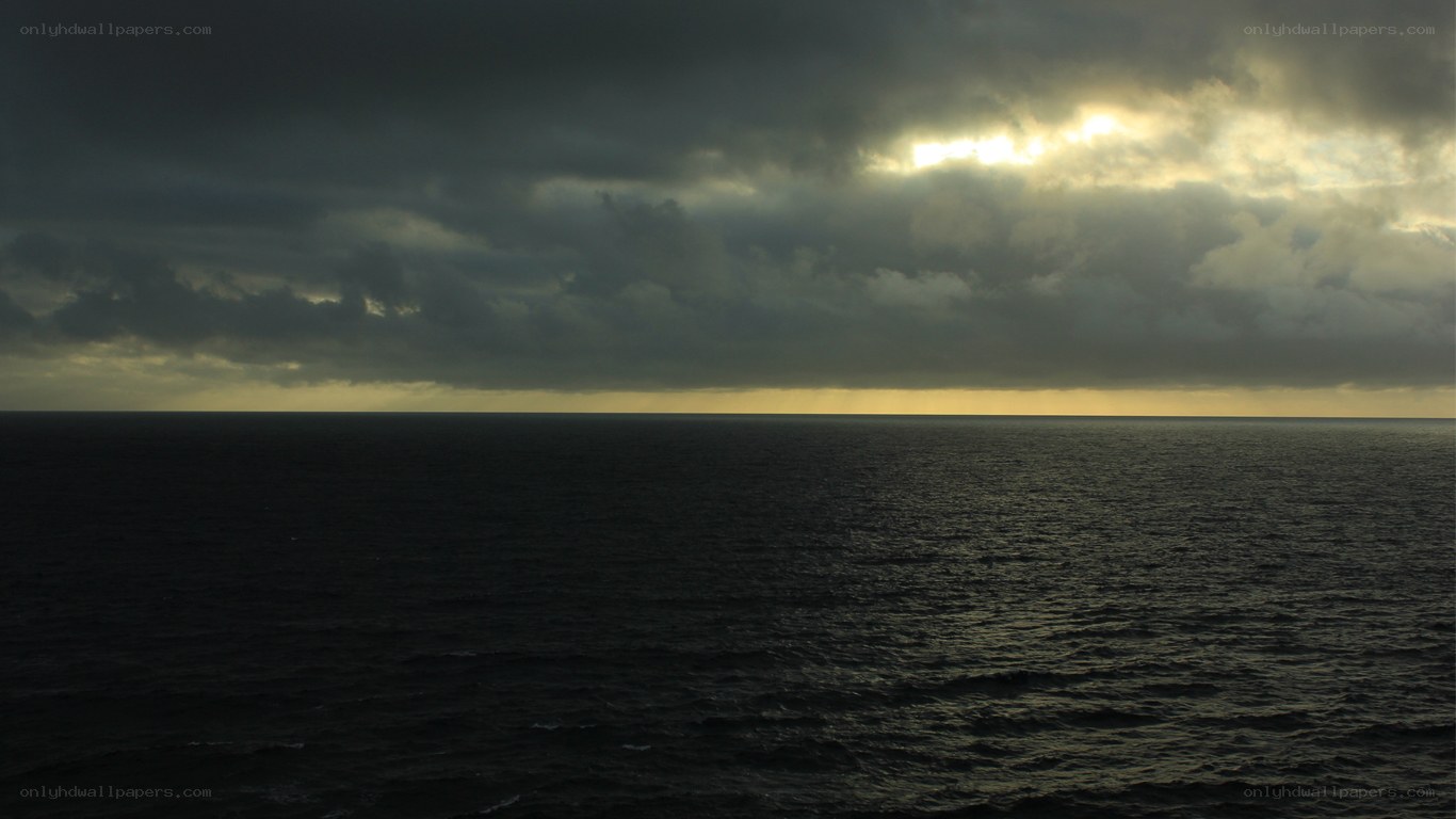dark ocean under stormy sky