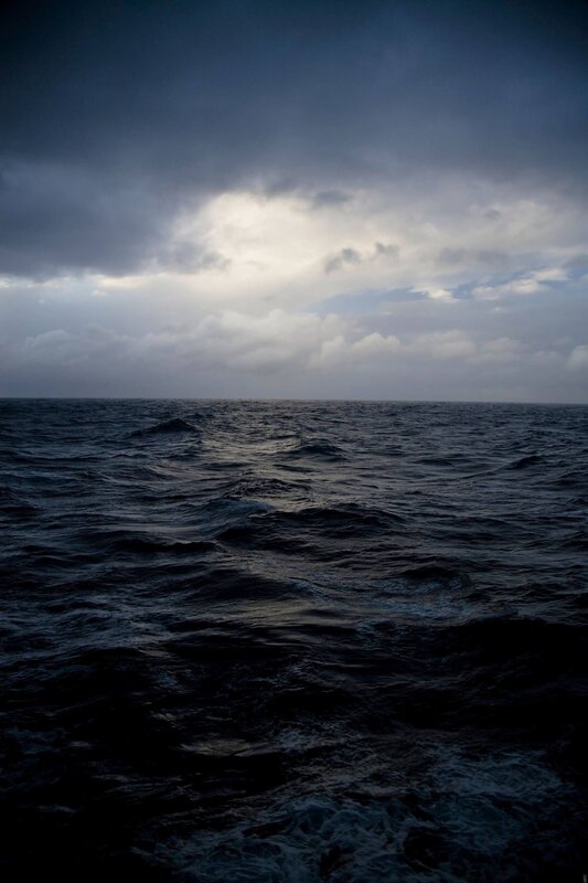 dark ocean under stormy sky