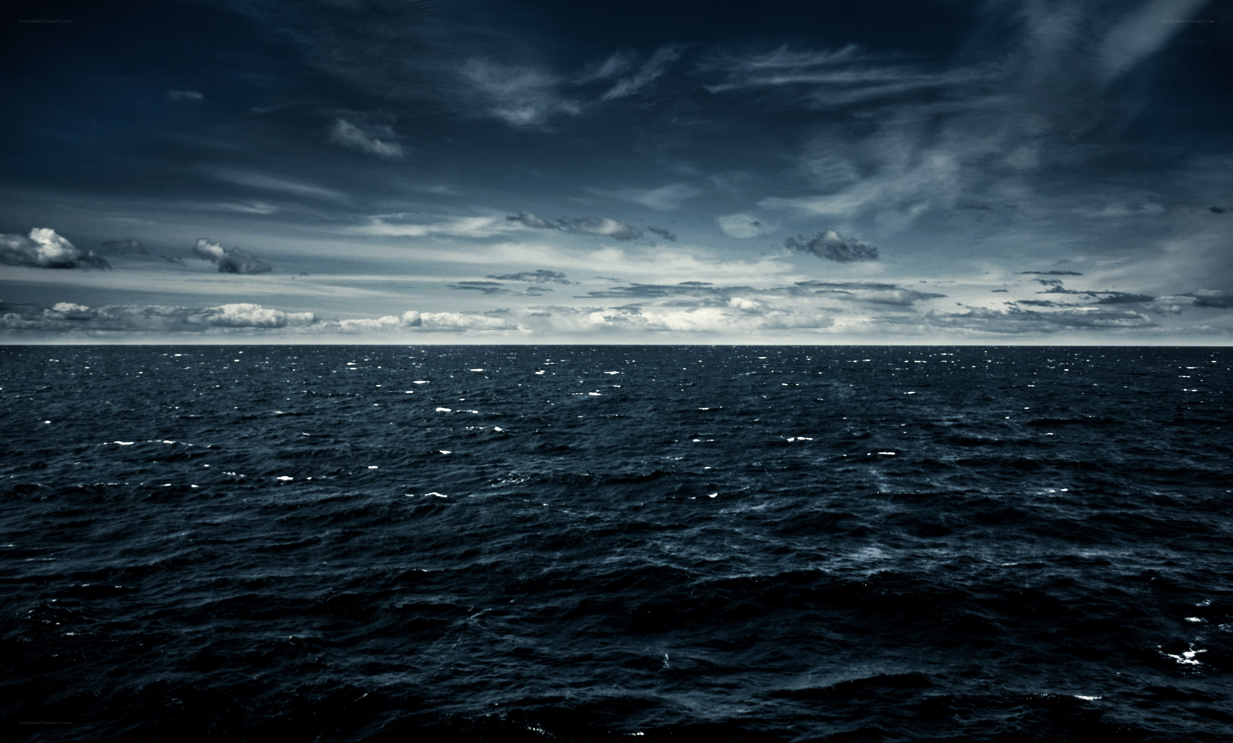 dark ocean under stormy sky