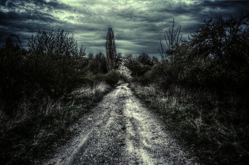 dark path under cloudy sky