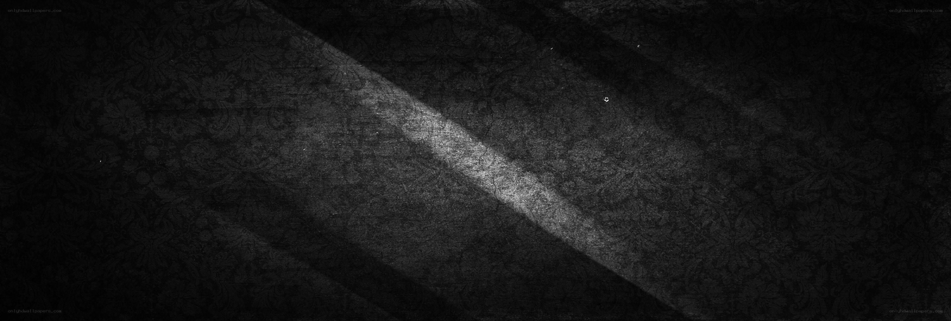 dark patterned surface with light beam