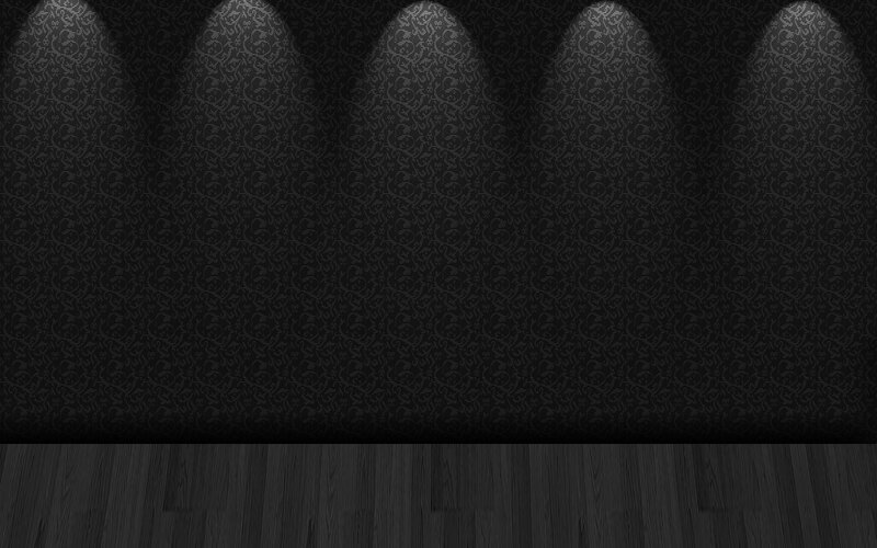 dark patterned wall with spotlights