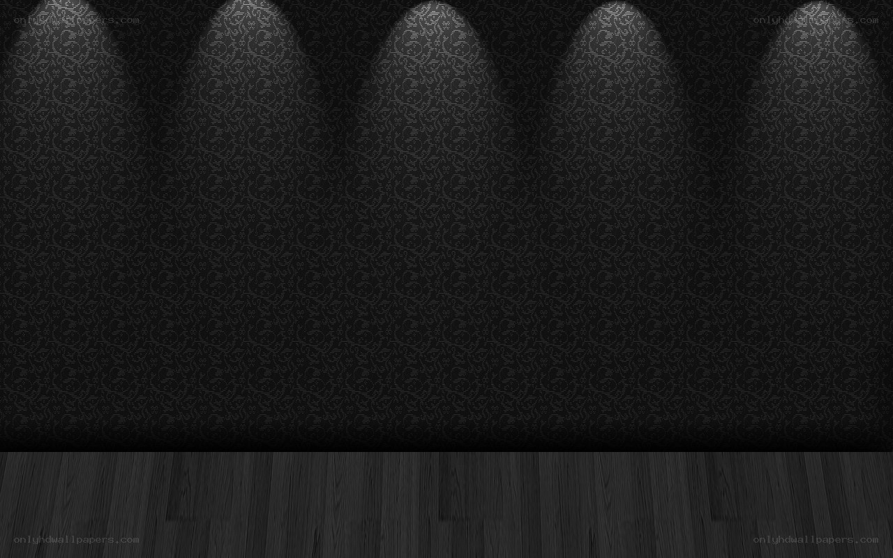 dark patterned wall with spotlights