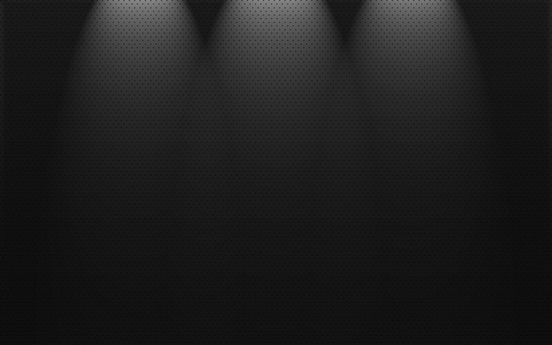 dark perforated background with spotlights