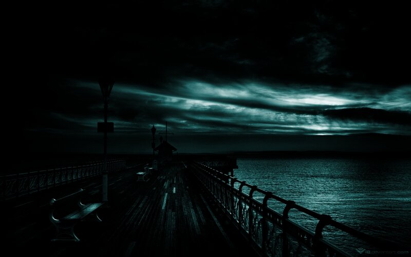 Dark pier at night