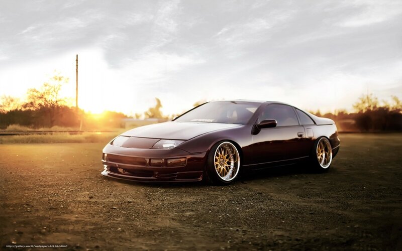 dark purple sports car at sunset