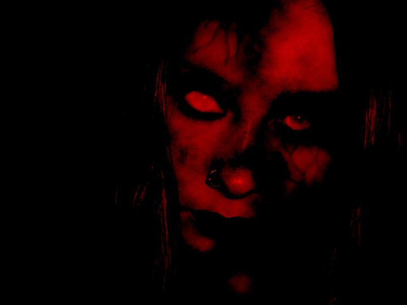 dark red-lit face