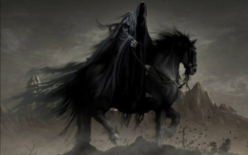 Dark rider on a black horse