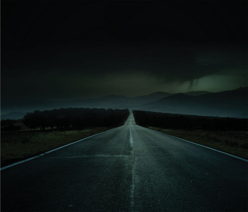Dark road at night with storm