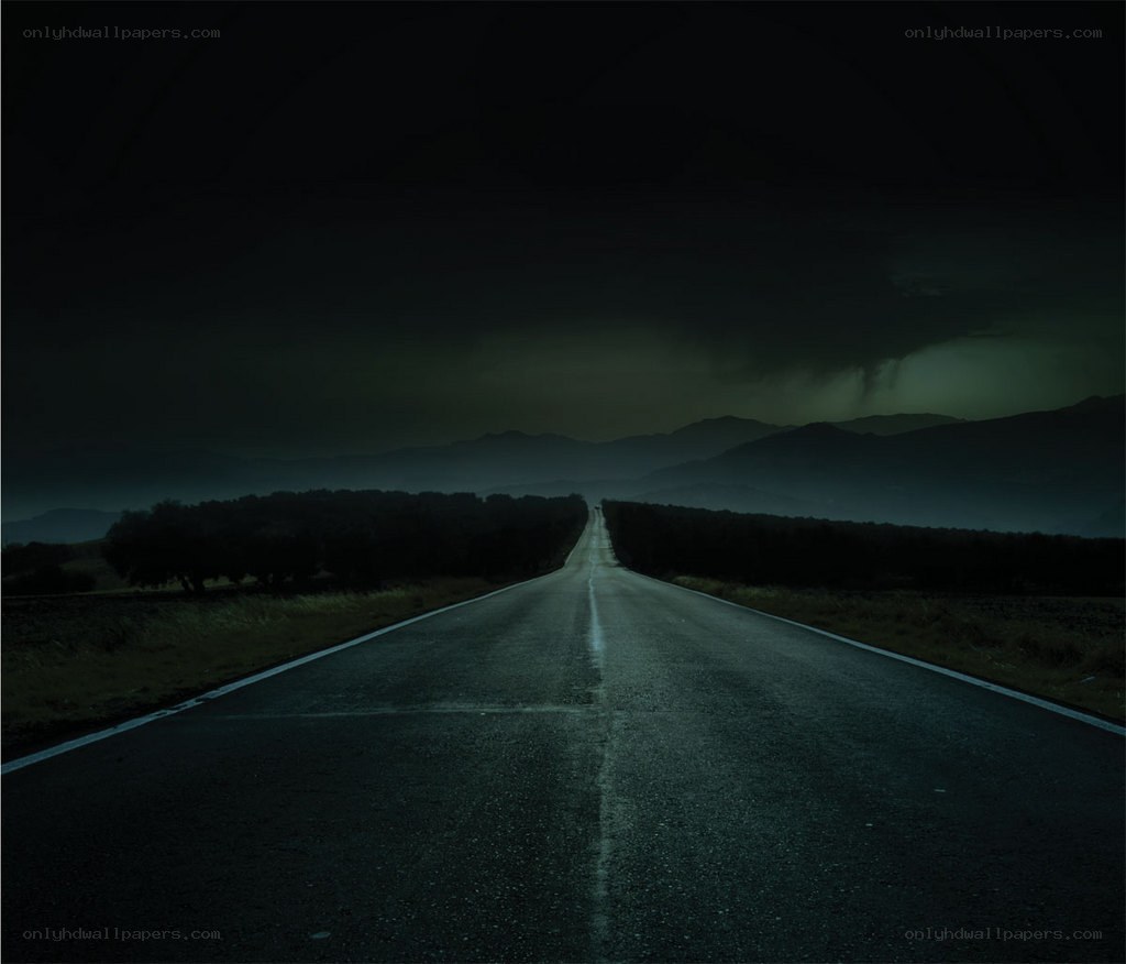Dark road at night with storm