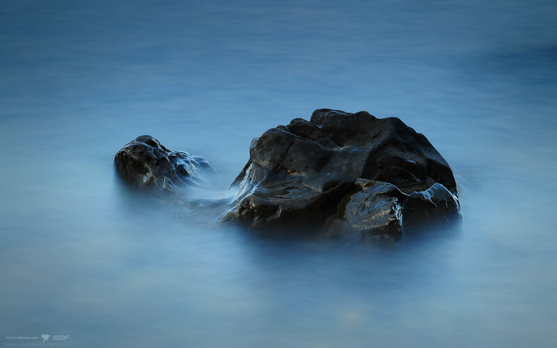 Dark Rocks in Water — Blue