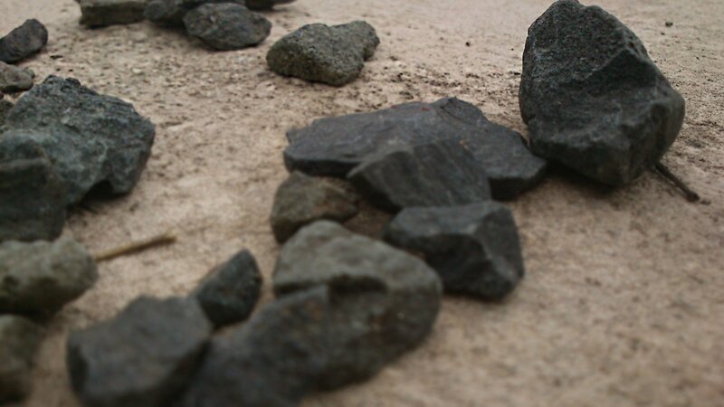 Dark Rocks on Sand