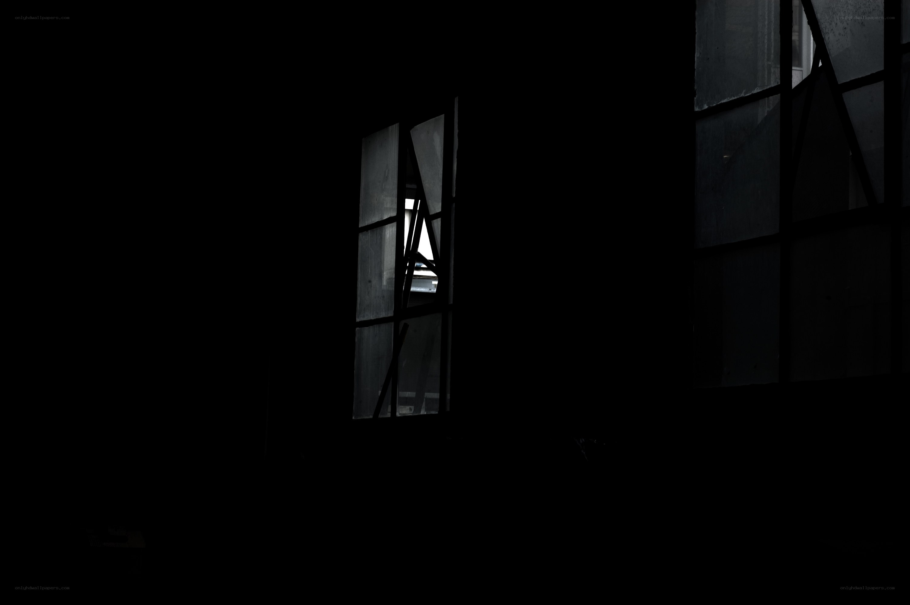 dark room with broken windows