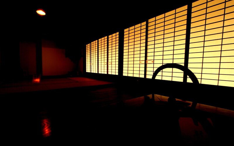 dark room with glowing shoji screens