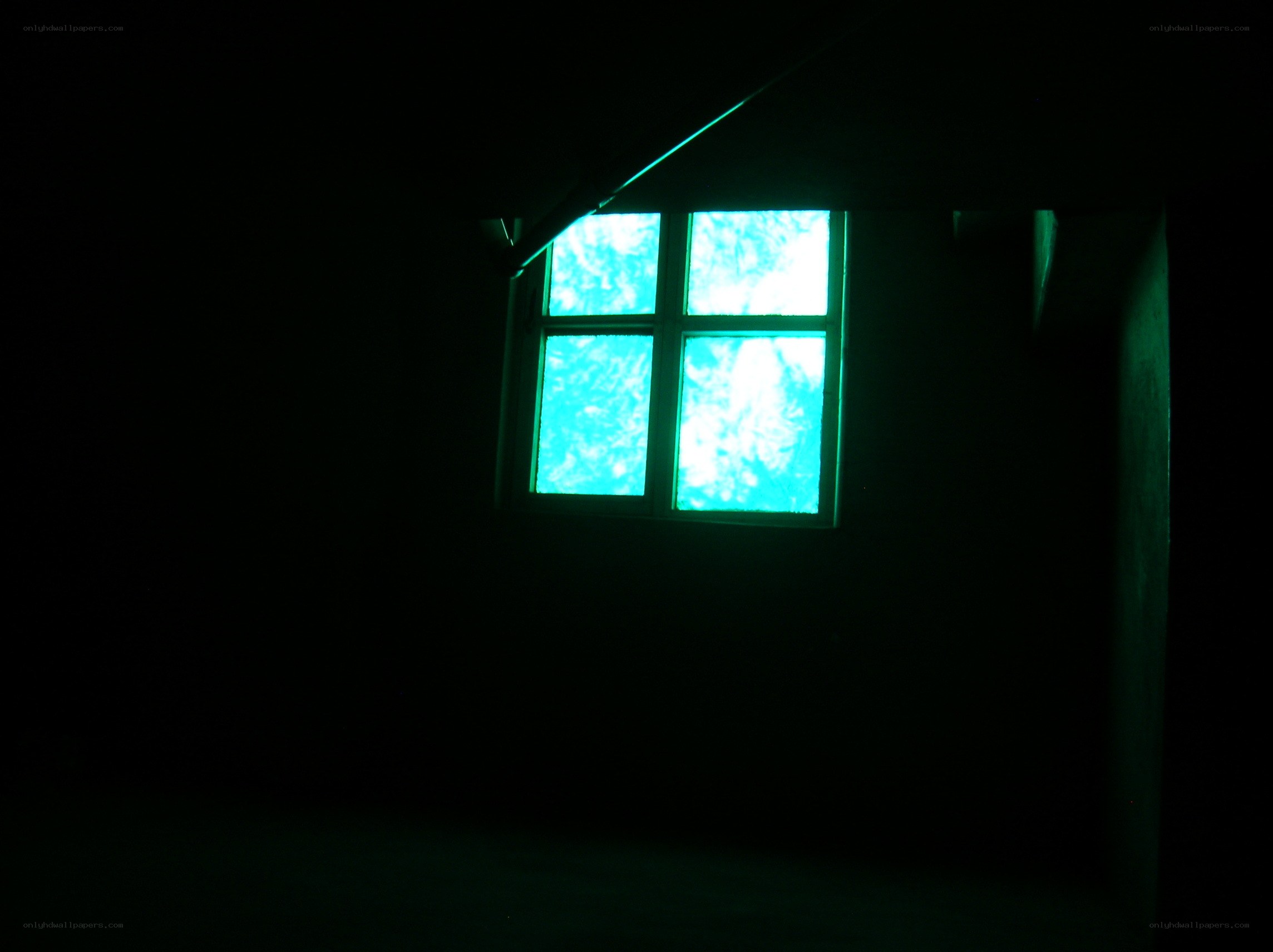 dark room with glowing window