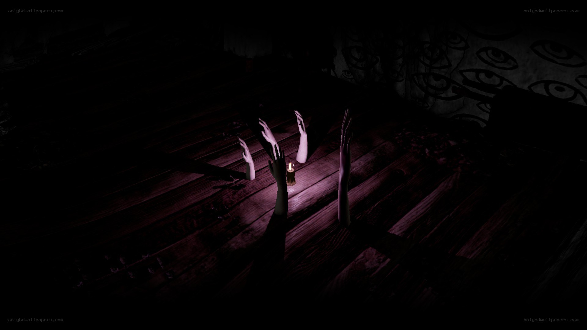 Dark room with hands and candle