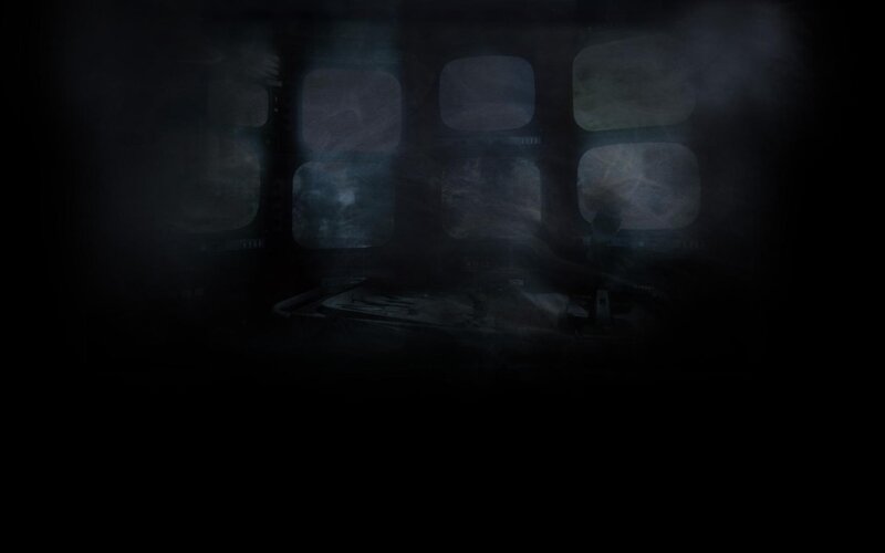 dark room with monitors