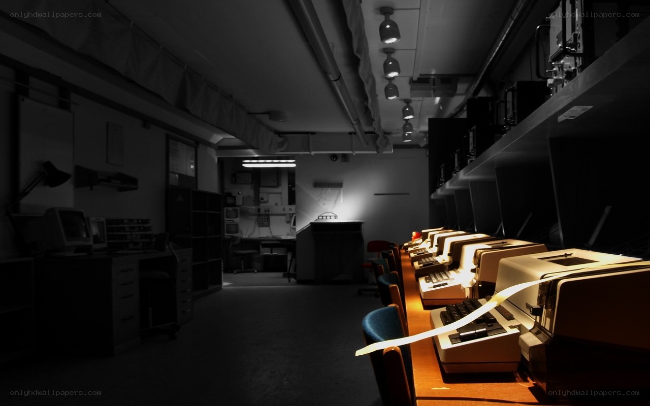 dark room with old typewriters