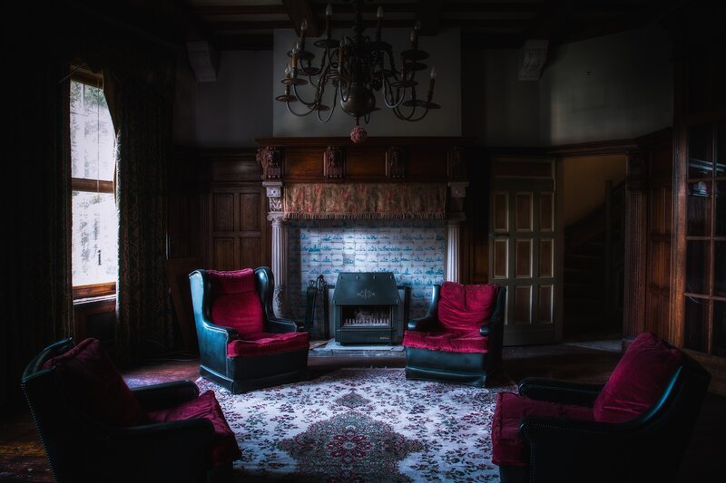 Dark room with red chairs