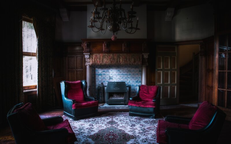 Dark room with red chairs