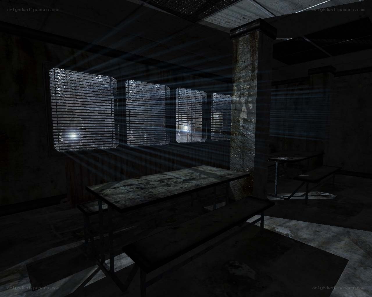 dark room with tables and windows