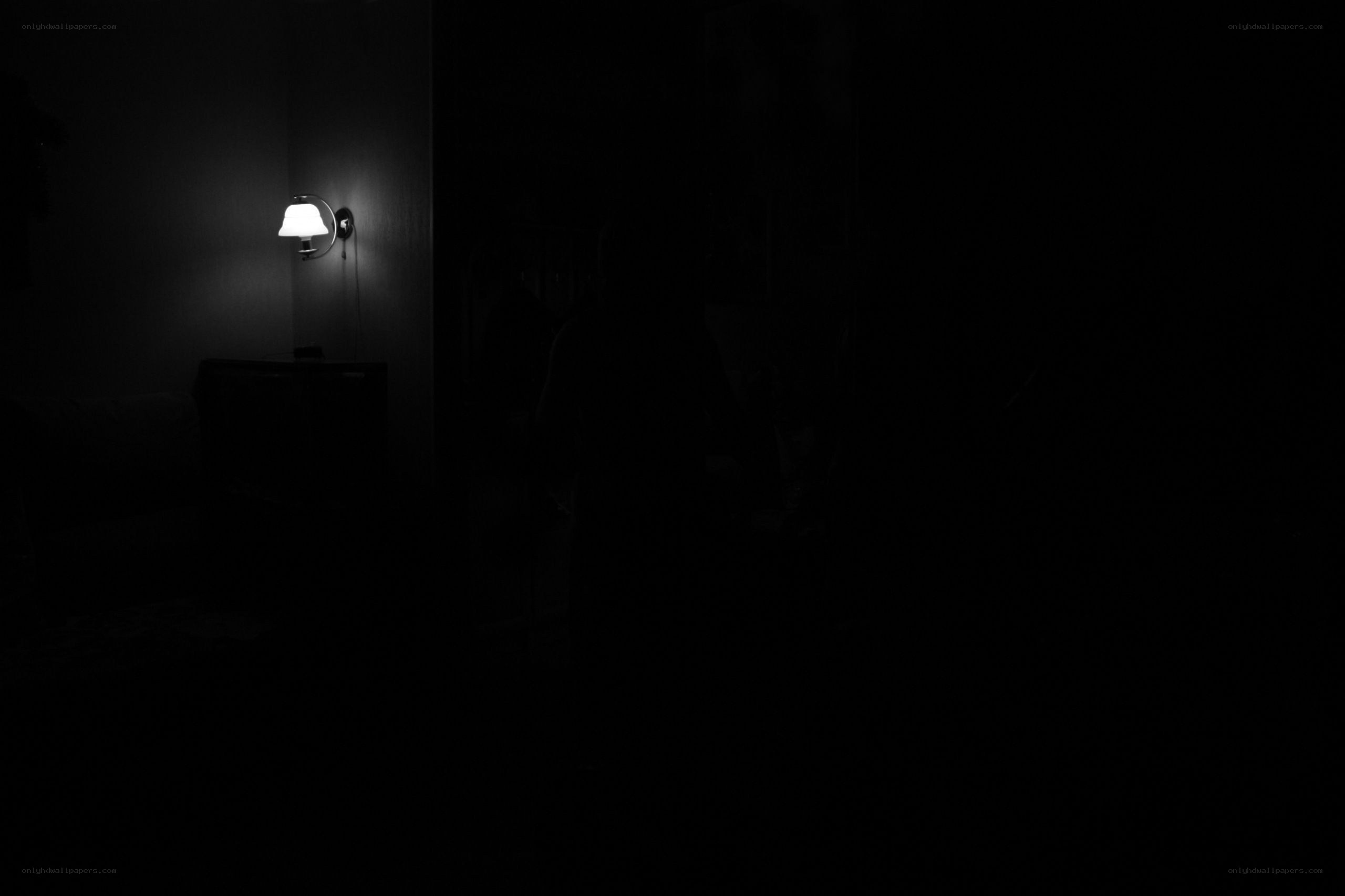 dark room with wall lamp