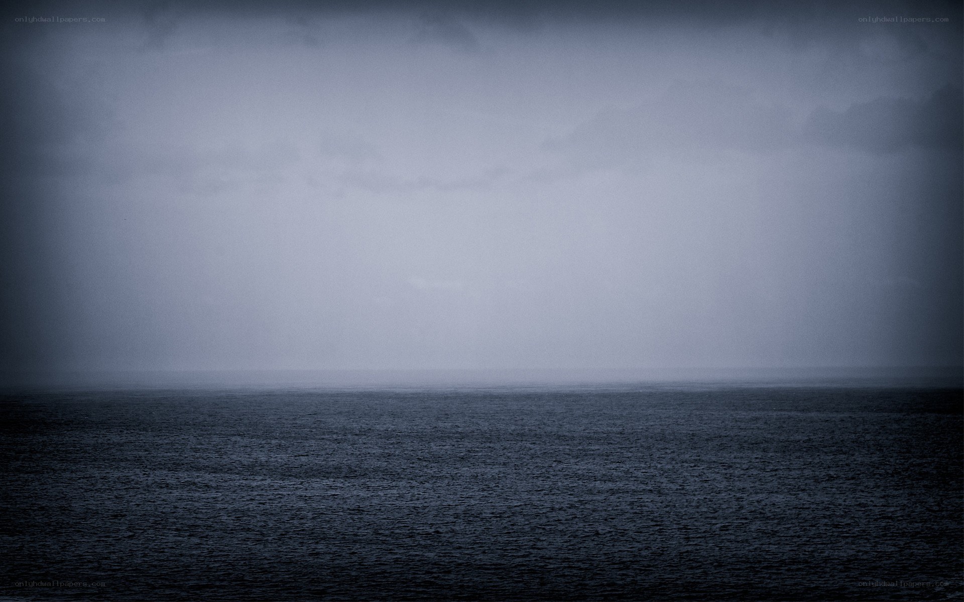 dark sea under stormy sky